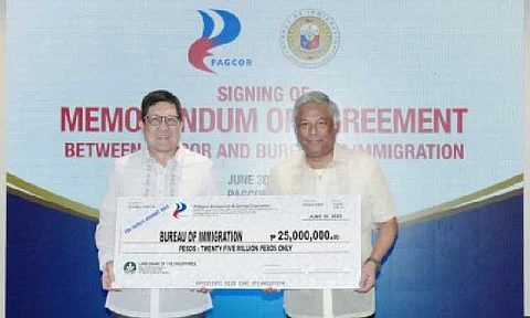 REPATRIATION EXPENSES. PAGCOR chairperson and CEO Alejandro Tengco (right) hands over the first tranche of the agency’s PHP50-million grant to Immigration Commissioner Joel Anthony Viado on June 30, 2025 at the PAGCOR Executive Office in Pasay City. The grant would help cover the repatriation expenses of illegal POGO workers currently held at the BI Warden Facility and Protection Unit. (PAGCOR photo)