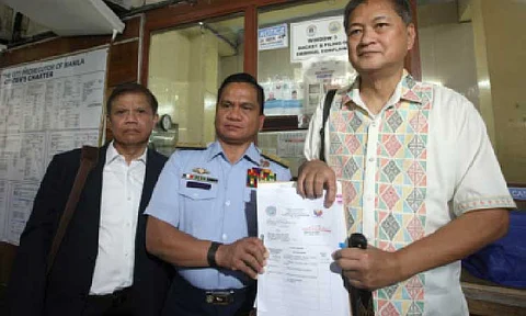CYBERLIBEL CASE. Philippine Coast Guard Spokesperson for the West Philippine Sea Commodore Jay Tarriela (center) files a cyberlibel case against blogger Sass Sasot before the Manila Prosecutor's Office at the city hall on Friday (July 4, 2025). Tarriela said the complaint is in response to a series of "baseless, malicious, and deeply personal online attacks" made by Sasot against him between July and October last year. (PNA photo by Yancy Lim)
