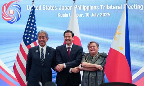 Japanese Foreign Minister Takeshi Iwaya, US Secretary of State Marco Rubio, and Philippine Foreign Affairs Secretary Theresa Lazaro (left to right) shake hands at their meeting in Kuala Lumpur on Thursday (July 10, 2025). (Courtesy of Japan's Foreign Ministry)