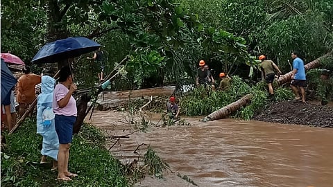 ANTIQUE. Soldiers from the Philippine Army’s 61st Infantry Battalion and community volunteers clear a road in Barangay Importante, Tibiao, Antique, on July 17, 2025, following heavy rains and flooding caused by Tropical Depression Crising.