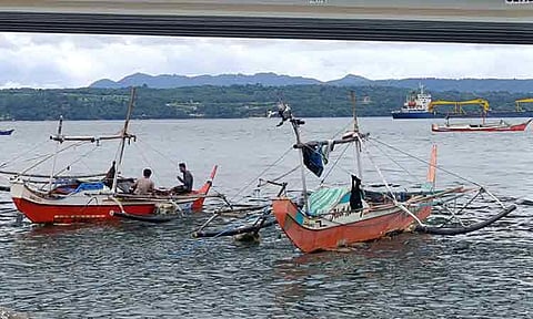 Despite the cloudy weather fisherfolks tend to their fishing boats along Magsaysay Park in Davao City on Thursday afternoon, June 19, 2025.