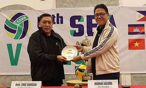 CANDON City Mayor Eric Singson (left) received a volleyball signed by the team captains of the SEA V.League teams from AVC and PNVF president Ramon “Tats” Suzara.