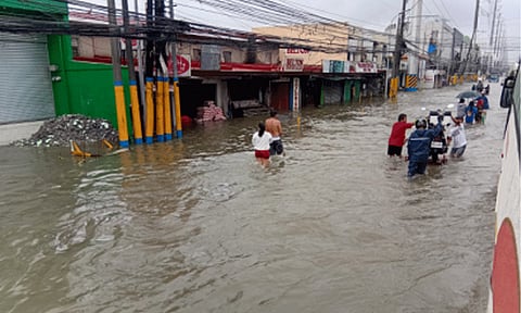 SOAKED. A portion of Aguinaldo Highway in Bacoor, Cavite is submerged in a knee-deep flood following a heavy downpour on Tuesday (July 22, 2025). Energy Assistant Secretary Mario Marasigan, in an interview over PTV, said transmission facilities are in normal condition amidst the continuous rains that cause flooding, which affects power distribution. (PNA photo by Jelly Musico)