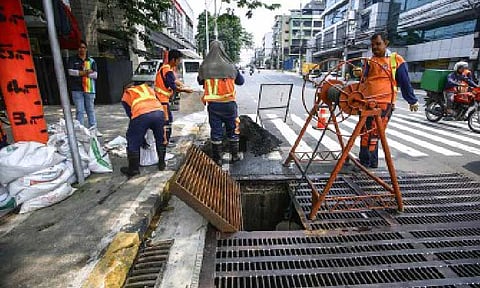 FLOOD CONTROL. The Department of Public Works and Highways continues to conduct declogging of drainage systems, like along Timog Avenue in Quezon City on Aug. 5, 2025. The National Capital Region’s biggest city in terms of population, Quezon City was also among the areas most affected by flooding caused by the southwest monsoon (habagat) and a series of typhoons in July. (PNA photo by Joan Bondoc)