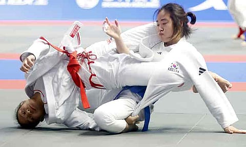 FINALS-BOUND. Philippines’ Jenna Kaila Napolis, red trunks, advances to the gold medal match in the 2025 World Games women’s jiu-jitsu 52kg ne-waza event, where she will face her earlier opponent Eon Ju Im of South Korea, blue trunks, at the Jianyang Cultural and Sports Centre Gymnasium, Sunday, August 10.