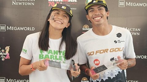 CHAMPIONS. Southeast Asian Games medalists Erika Nicole Burgos (left) and Kim Andrew Remolino topped their respective divisions in the Sunrise Sprint Lapu-Lapu in Mactan, Cebu, on Aug. 10, 2025. / VIA PNA