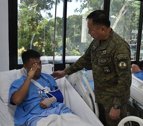 ZAMBOANGA. The Army’s 11th Infantry Division (11ID) awards Wounded Personnel Medal for gallantry to the four soldiers who were injured in a clash that saw the death of a notorious fugitive in Sulu on Saturday. Major General Leonardo Peña, 11ID and Joint Task Force Orion commander (right), personally awarded the WPM when he visited the four soldiers in the hospital.