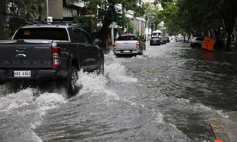 FLOODED STREET. Motorists brave flood along Pedro Gil St. in Manila on Sunday (Aug. 24, 2025). The House of Representatives is launching a full and transparent investigation into alleged corruption in the government’s flood control program -- declaring that no one will be spared of penalties if found accountable. (PNA photo by Avito Dalan)