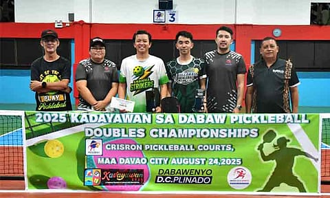 PICKLEBALL CHAMPS. Cotabato City pair Ahmil Hussein “Kaka Jeng” Ampatuan Macapendeg, third from left, and Sigmond Escalona, fourth from left, receive their prizes from the Sports Development Division of the City Mayor’s Office (SDD-CMO) personnel for clinching the intermediate title of the 2025 Kadayawan sa Dabaw Pickleball Doubles Championships at Crisron Pickleball Court in Maa, Davao City, on Sunday, August 24. Also in the photo is tournament director Juanito “Titong” Cansino.