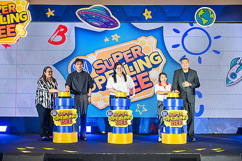 The 2025 SM Super Spelling Bee officially kicked off with the pressing of the Golden Buzzer by (L-R) Isabele Valente, Academic Director of NU Nazareth School; Steven Tan, President of SM Supermalls; Hanna Carinna Sy, AVP for Marketing Special Events and Leasing, SM Supermalls; Bea Torres, AVP for External Relations, National Bookstore; and Joaquin San Agustin, Executive Vice President for Marketing, SM Supermalls.