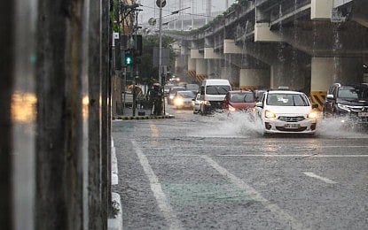 DRENCHED. Heavy afternoon rainfall submerged several areas in Quezon City on Saturday (Aug. 30, 2025). PAGASA said rains will persist in several parts of the country, including Metro Manila, on Sunday (Aug. 31) due to the southwest monsoon or "habagat" while two low pressure areas are being monitored inside the Philippine Area of Responsibility. (PNA photo by Joan Bondoc)