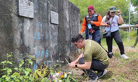 NUMBERED NICHES, UNNUMBERED GRIEF. Mindanao community journalists offered flowers, lit candles, and said prayers at the graves of unidentified victims of Super Typhoon Pablo at the public cemetery in New Bataan, Davao de Oro, on Sunday, July 27, 2025. Each niche is marked with a number, preceded by the code PNB-12—short for “Pablo New Bataan, 2012.” Nearly 400 people were reported dead in the disaster, with several still missing to this day. Meanwhile, the visit was part of the “Reporting on Climate Disaster & Displacement: Media Safety Training for Mindanao Journalists,” organized by the Mindanao Institute of Journalism.