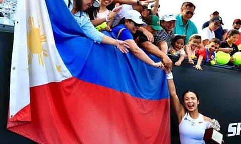 FILIPINO PRIDE. Alex Eala, the first Filipino to win a WTA title, celebrates with an ecstatic crowd of kababayans waving the Philippine flag, making her historic Guadalajara 125 Open triumph in Mexico even more special.