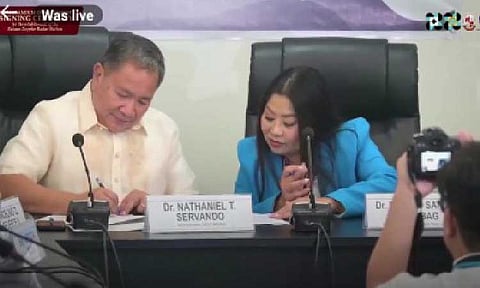 PARTNERSHIP. Philippine Atmospheric, Geophysical and Astronomical Services Administration Administrator Nathaniel Servando (left) and Bataan Peninsula State University president Dr. Ruby Santos-Matibag sign a memorandum of agreement at the weather bureau's office in Quezon City on Monday (Sept. 8, 2025) for the establishment of a first Doppler radar station in the province. PAGASA will utilize a portion of the university's land, free of charge. (Screengrab from PAGASA FB live)