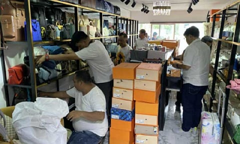 FAKE. National Bureau of Investigation (NBI) agents inventory the seized luxury items at a store in Bulacan on Sept. 8, 2025. The NBI said Friday (Sept. 12) the operation in two stores yielded nearly PHP35 million worth of fake Louis Vuitton bags. (Photo courtesy of NBI PIO)