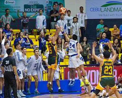 OVERTIME TRIGGER. University of San Jose-Recoletos (USJ-R) Jaguar Cubs skipper Clyve Heinrich Antig draws a foul from Cebu Eastern College (CEC) defender John Denver Jopia while taking a three-pointer. Antig sank all his three free throws thereafter to send the game into overtime, where USJ-R outlasted CEC, 70-62. /