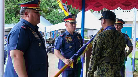 ZAMBOANGA. Police Brigadier General Jaysen De Guzman, Police Regional Office-Bangsamoro Autonomous Region (Pro-Bar) director (center), hands over the Sulu Police Provincial Office (SPPO) flag to Police Major General Lex Ephraim Gurat, Philippine National Police’s Director for Plans (right), in a turnover ceremony Monday, September 15, transferring the SPPO under the administrative supervision and operational control to Police Regional Office (PRO)-Zamboanga Peninsula. In turn, Gurat, the ceremony’s presiding officer, handed over the flag to Police Brigadier General Eleazar Matta, PRO-Zamboanga Peninsula director. (left) (SunStar Zamboanga)