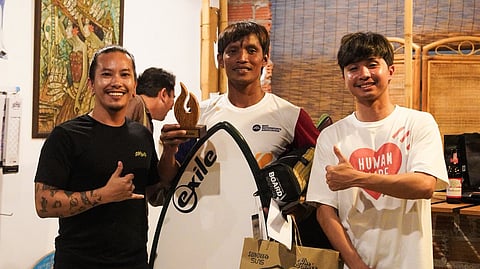 SKIMBOARDING KING. Rodel Patawi of the Mati Watersports Association (MWA), center, clinches the open division champion’s trophy in the recently concluded Krabi Skimboarding Competition in Thailand.