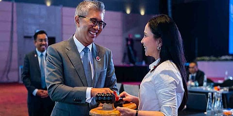 Malaysia’s Minister of Investment, Trade and Industry H.E. Tengku Datuk Seri Utama Zafrul Tengku Abdul Aziz hands over the ASEAN Economic Ministers’ (AEM) Chairship to Philippine Trade and Industry Secretary Cristina A. Roque during a ceremony in Kuala Lumpur, Malaysia, on September 23, 2025.
