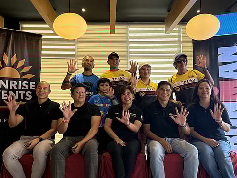 FIVE AND STRONG. Organizers of Ironman 70.3 Davao flash the “five” sign during a press conference on Friday, October 3, 2025, at the Arcadia Active Lifestyle Center. The gesture marks the fifth edition of the premier triathlon race, which returns to Davao City in 2026 after a one-year break.