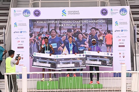 CHAMP AGAIN. Former Davao City standout Sonny Wagdos, center, once again put the Philippines on top of the podium after ruling the 10K men’s open of the Kuala Lumpur Standard Chartered Marathon 2025 on October 4 in Malaysia. He clocked 32 minutes and 26 seconds, finishing ahead of Malaysians Sanjay Manimaran (left) and Darren James Nair (right). Wagdos’ latest victory came just a month after his 10K title run in Thailand.
