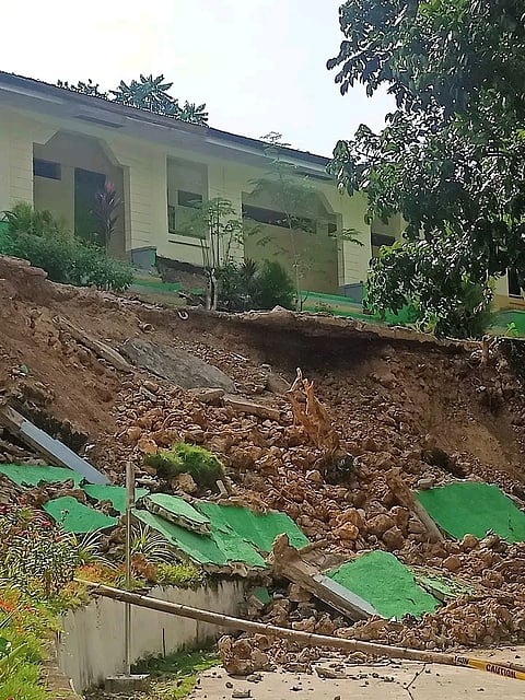 FENCE IN PIECES. The tremor caused the collapse of a concrete fence at San Miguel National High School in San Remigio town, northern Cebu. /