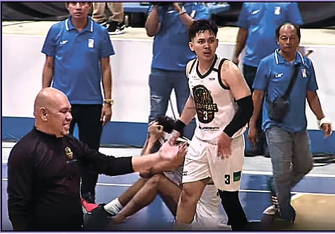POINT OF CONTENTION. Cebu Greats team manager Jhon Santos (left) approaches the table officials and referees to complain about the uncalled foul on Jun Manzo’s (3) buzzer-beater three-point attempt during their game against the Mindoro Tamaraws.
/