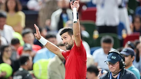 Djokovic stays on track in Shanghai