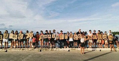 SIARGAO. Locals dramatize their resistance against the influx of Israeli military personnel and what they called the “settler colonization” of Siargao through a peaceful one-kilometer solidarity walk at Sunset Bridge in General Luna town on September 14, 2025.