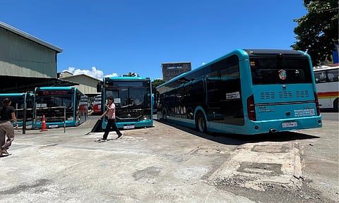 WHEELS OF CHANGE. Ten new low-floor buses under the Davao City Interim Bus Service (DIBS) line up at the Davao City Overland Transport Terminal on Tuesday, October 14, 2025. Funded by the city government, the buses will start free operations by mid-November to help ease rush-hour congestion and improve commuter travel as the city awaits the rollout of the ₱73-billion Davao Bus Project of the Department of Transportation (DOTr).
