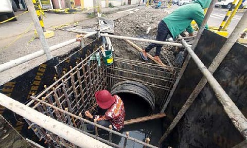 EXPEDITED WORK. Personnel of the Department of Public Works and Highways work on a drainage project along Legaspi Street in Poblacion District, Davao City on June 13, 2024. At the time, the 20th City Council passed a resolution demanding the DPWH to expedite unfinished road repair and other infrastructure projects. (PNA file photo by Robinson Niñal Jr.)