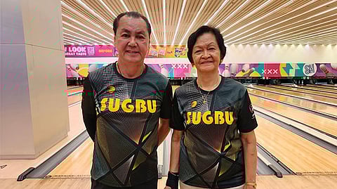 THE FINALISTS. Champion Dory Enoveso (right) and first runner-up Rene Ceniza share a smile after their title duel in the SugBU Bowler of the Month tournament for October.