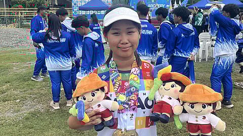 GOLDEN GIRL Davao City’s Abigail Jane Lim displays her six gold medals and plush dolls after sweeping all her events in the girls’ 17-under division at the Batang Pinoy 2025 archery competition in General Santos City, Thursday, October 30, 2025.