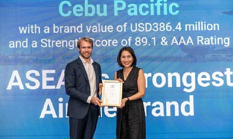 RECOGNITION. Cebu Pacific Chief Marketing and Customer Experience Officer Candice Iyog receives the award for ASEAN's Strongest Airline Brand from Brand Finance Managing Director for Asia Pacific Alex Haigh in a ceremony in Singapore on Nov. 7, 2025. Iyog thanked the people behind the low-cost carrier, acknowledging that the airline's strength comes from them. (Photo from Cebu Pacific)