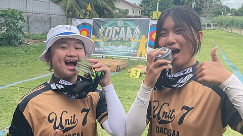 GOLDEN GIRLS. Cousins Daphne Manuelle Uyking, left, and Jasmine Jane Lim of Unit 7 pose with their medals after leading the secondary girls division in the Dcaa Meet 2025 archery tournament at the Davao Archery Club Inc. Range in Lanang, Davao City. Lim won three golds and four silvers, while Uyking added three golds and five silvers as both advanced to the 2026 Davraa Meet.