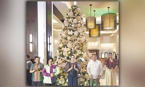TREE OF JOY. The tree-lighting frontliners, from left, Seda Ayala Center Cebu’s financial controller Ruben Bancaya, AyalaLand Hospitality’s head of marketing and commercial Roshan Nandwani, cluster general manager Gwen Dela Cruz, director of human resources Bobot Codoy and director of sales Valerie Ann Frias.