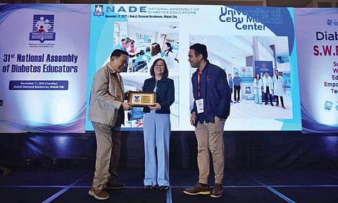 AWARDING. Dr. April Melody Abcede, MD (center), DNC unit head, receives for UCMed the award for Clinic of Competence from Dr. Augusto D. Litonjua, MD (left), president of PCDEF Diabetes Center Philippines, at Manila Hotel with Joshua David Bendoy (right), lead diabetes dietitian educator.