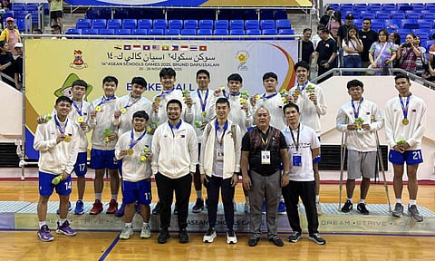GOLDEN BOYS. Members of the Philippines boys basketball team hold their gold medals after defeating Malaysia 90-86 in overtime to win the 14th Asean Schools Games championship Thursday, November 27, 2025, at the Indoor Stadium of the Hassanal Bolkiah National Sports Complex in Brunei. The Davao City-led squad, coached by Jess Linus Evangelio, was praised for its teamwork, grit, and heart in a historic first ASG title.