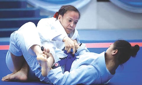FIRST GOLD. Kimberly Custodio pins down Thai opponent Sugun Nutchaya in their women’s 48kg jiu-jitsu ne-waza final at the 33rd Southeast Asian Games in Bangkok, Thailand. The win gave Custodio a gold medal in her first SEA Games stint. /