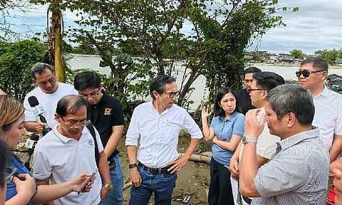 Department of Public Works and Highways (DPWH) Secretary Vivencio Dizon instructs the newly-appointed officials of the DPWH-Bulacan First District Engineering Office to complete all gaps in unfinished dikes across the province during an inspection on the flood control project in Barangay Bulusan, Calumpit, Bulacan. (Photo courtesy of PIA 3)