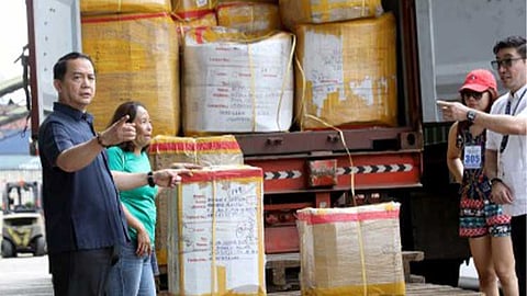 INSPECTION. Bureau of Customs Commissioner Ariel Nepomuceno (left) during the inspection of balikbayan boxes on December 18, 2025 at the BOC main office in Manila.