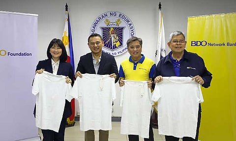 UPLIFTING TEACHERS. (from left) UNIQLO Philippines Chief Operating Officer Geraldine Sia, Department of Education Secretary Sonny Angara, BDO Network Bank Group Head Alberto O. Quiogue, and BDO Foundation President Mario A. Deriquito during the ceremonial turnover of UNIQLO AIRism shirts for distribution of DepEd to public school teachers nationwide. (Photo courtesy of BDO)
