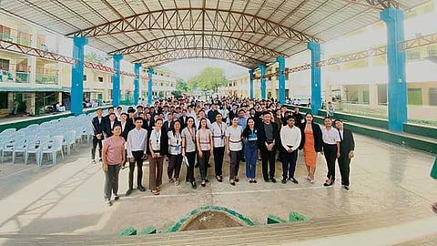 JOB INTERVIEW SIMULATION. Job interviewers, along with Grade 12 teachers and students of Labogon National High School, pose at the gymnasium on Dec. 17, 2025, before the Job Interview Simulation. The activity is part of their work immersion preparation. / SHANTI VENICE MANATAD