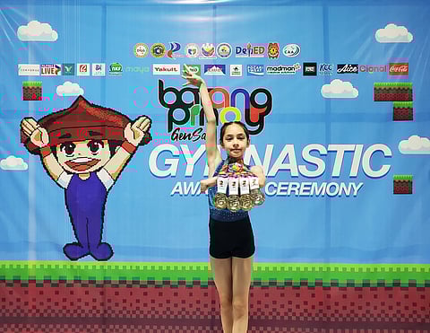 Davao gymnast Abigail Morrison celebrates after winning three golds and one silver at Batang Pinoy 2025. The 10-year-old Grade 5 student from Heartworks Learning Center is aiming for bigger victories in 2026, including the Davraa Meet and Palarong Pambansa.