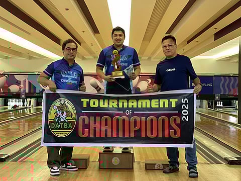 BEST OF THE BEST. Kim Salvador, center, receives his champion trophy and P20,000 cash prize from Datba President Rameses Tancontian, left, and treasurer Art Galendez during the 2025 Tournament of Champions awards ceremony at SM Lanang Bowling Center in Davao City on January 4, 2026.