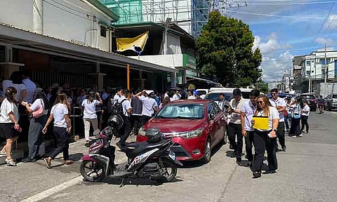 STRONG EARTHQUAKE. Students of Sta. Ana Elementary School and employees of the Department of Social Welfare and Development (DSWD) Field Office-Davao Region along R. Magsaysay Avenue in Davao City evacuated after a 6.4-magnitude earthquake struck off the coast of Manay, Davao Oriental, on Wednesday morning, January 7, 2026.