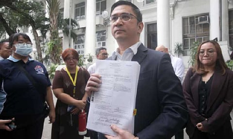 TAX DEFICIENCY CHARGES. Bureau of Internal Revenue Commissioner Charlito Martin Mendoza shows journalists the documents concerning the criminal complaints filed against Mark Allan Villamor Arevalo, sole proprietor of Wawao Builders, before the Department of Justice in Manila on Thursday (Jan. 8, 2026). The charges are in connection with an estimated PHP48.39 million in tax deficiency arising from a ghost flood-control project in Malolos City, Bulacan. (PNA photo by Yancy Lim)