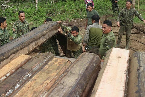 ZAMBOANGA. Authorities seize several illegally cut lauan logs on Saturday, January 10, in Sampinit Complex, the former bastion of the dreaded Abu Sayyaf Group in Basilan province.