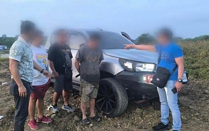 MURDER SUSPECT. Police personnel escort a murder suspect in Tanza, Cavite on Wednesday (Jan. 14, 2026). The man is a key suspect in the 2024 killing of Bulacan Association of Barangay Captains President Ramil Capistrano. (Photo by Jason de Asis)