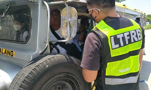 COMPLIANCE PERIOD. An enforcer of the Land Transportation Franchising and Regulatory Board-Central Luzon apprehends a colorum public utility vehicle in this undated photo. In settling fines and other compliance processes, the LTFRB issued a memorandum on Friday (Jan. 16, 2026) to adhere to working days, which is any day except Saturday, Sunday and holiday. (Photo courtesy of LTFRB Region 3)